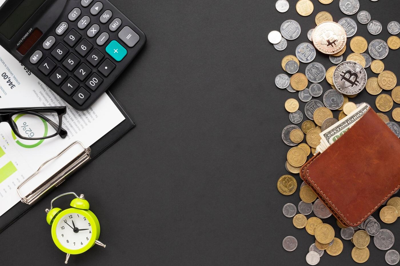 Person reviewing accounting records with a calculator